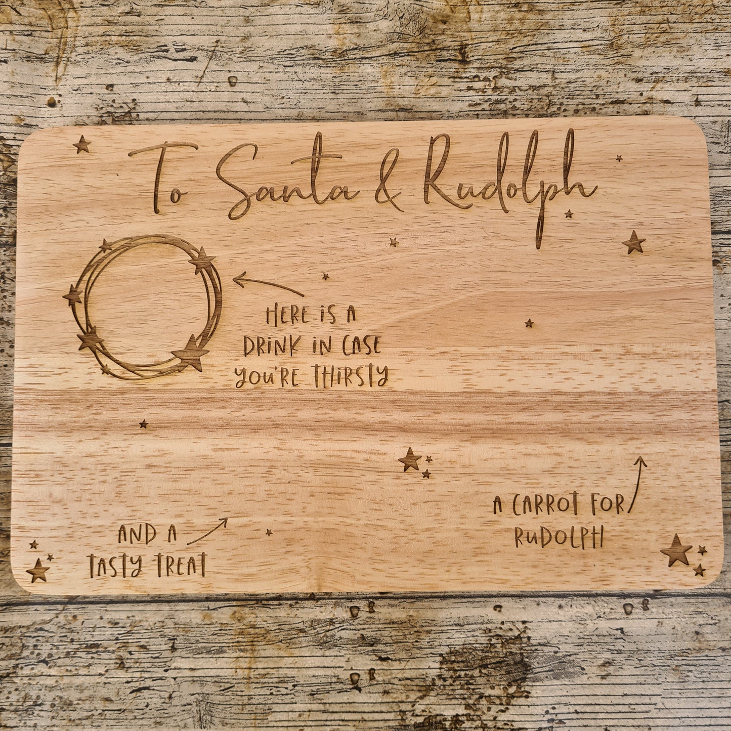 Wooden engraved board for Christmas eve father christmas treats and milk and carrot for reindeer