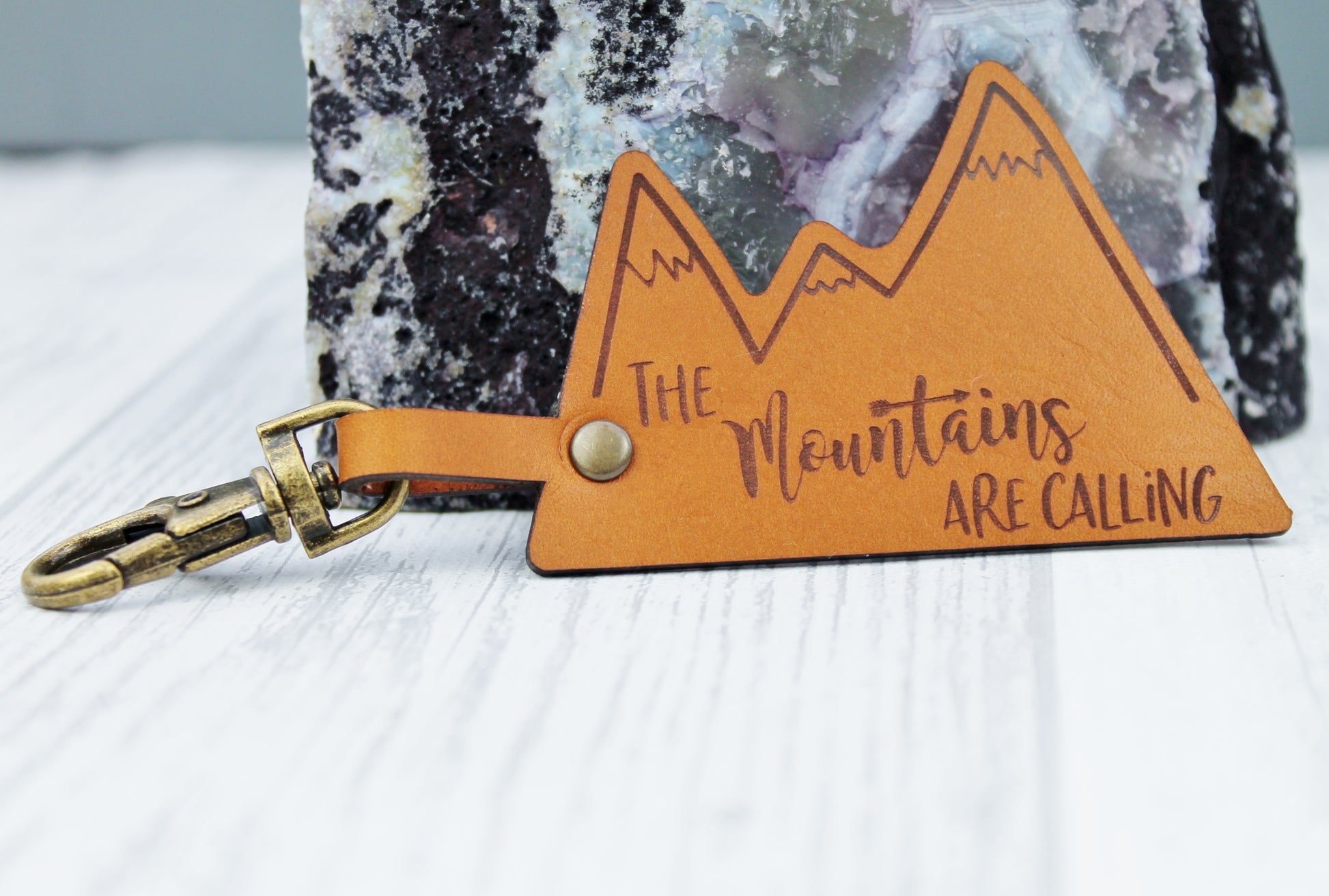 Mountain designed keying with adventuring quote 