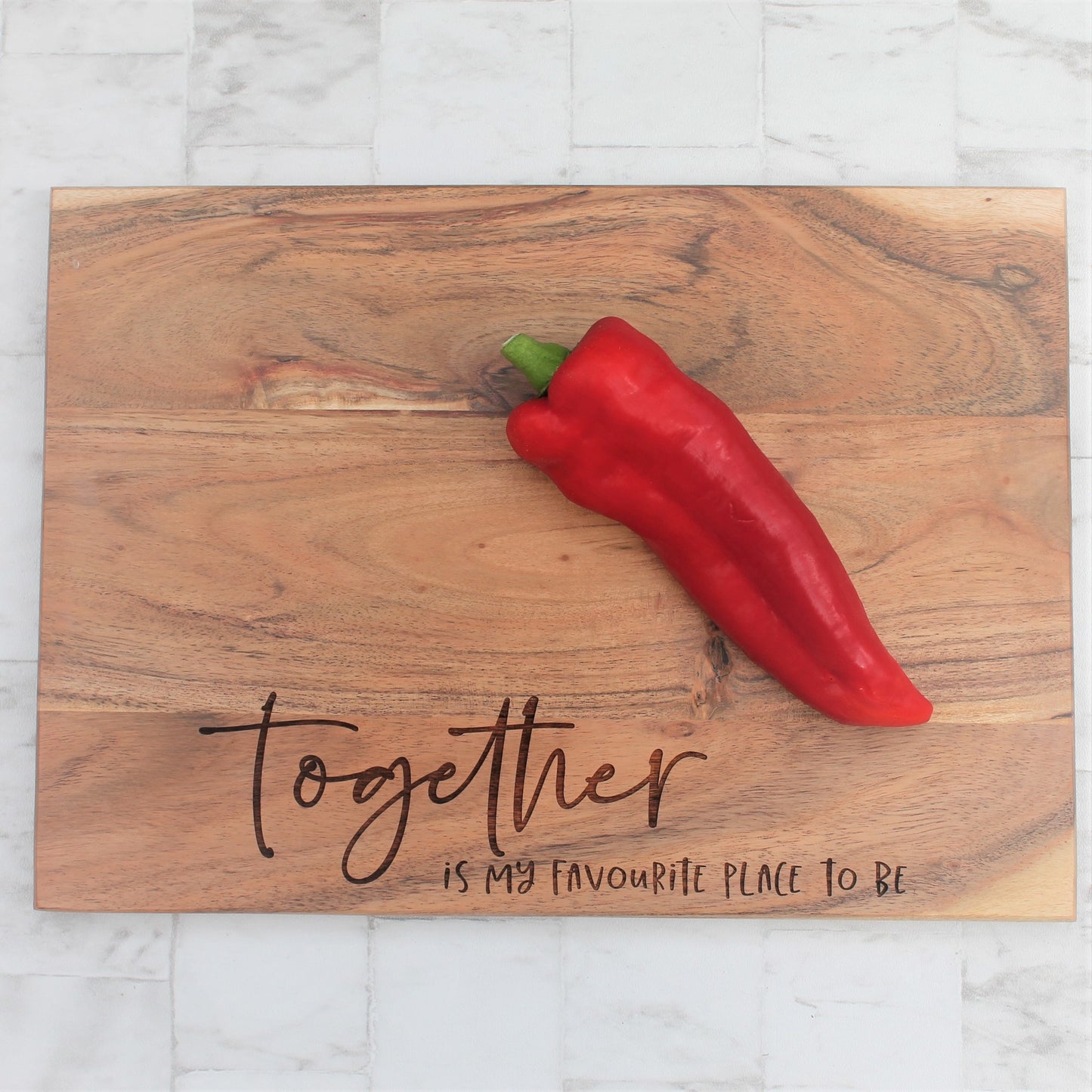 Wooden rustic engraved chopping board with the words eat cheese and brie happy