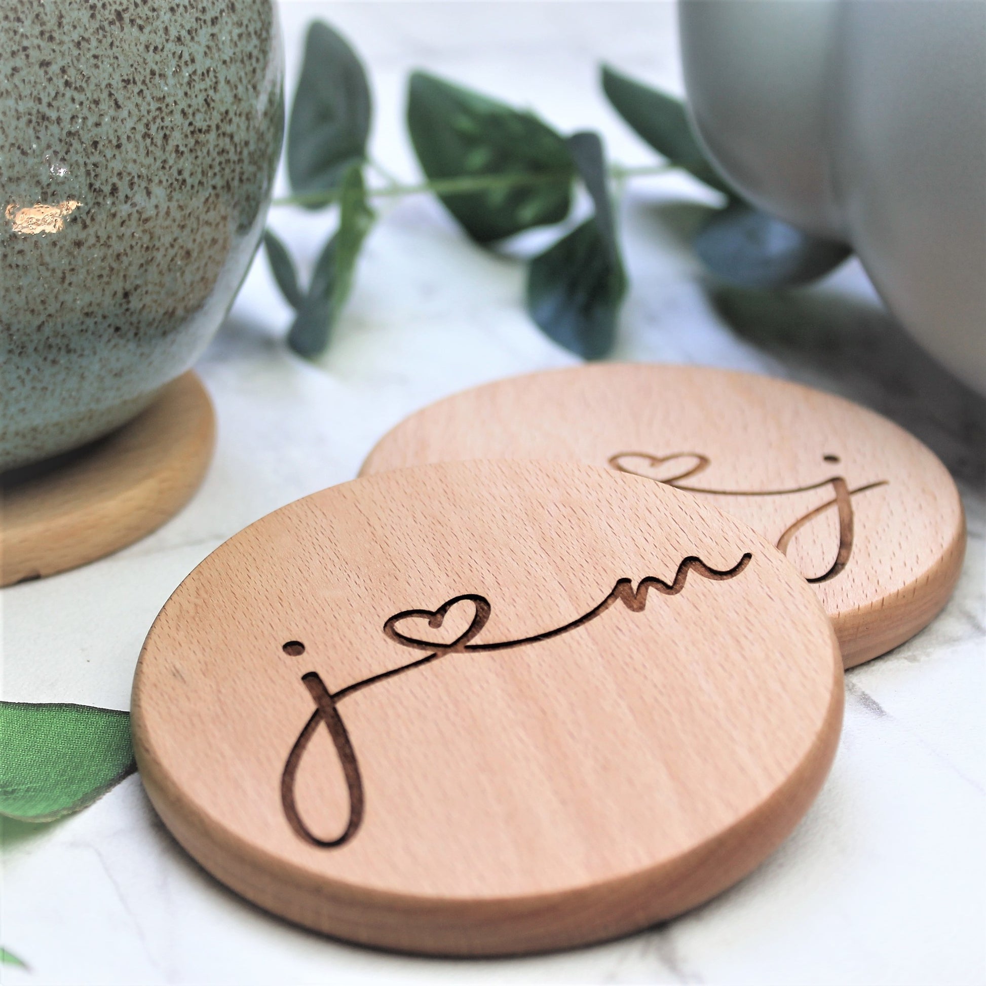 wooden couple coasters engraved with initials 