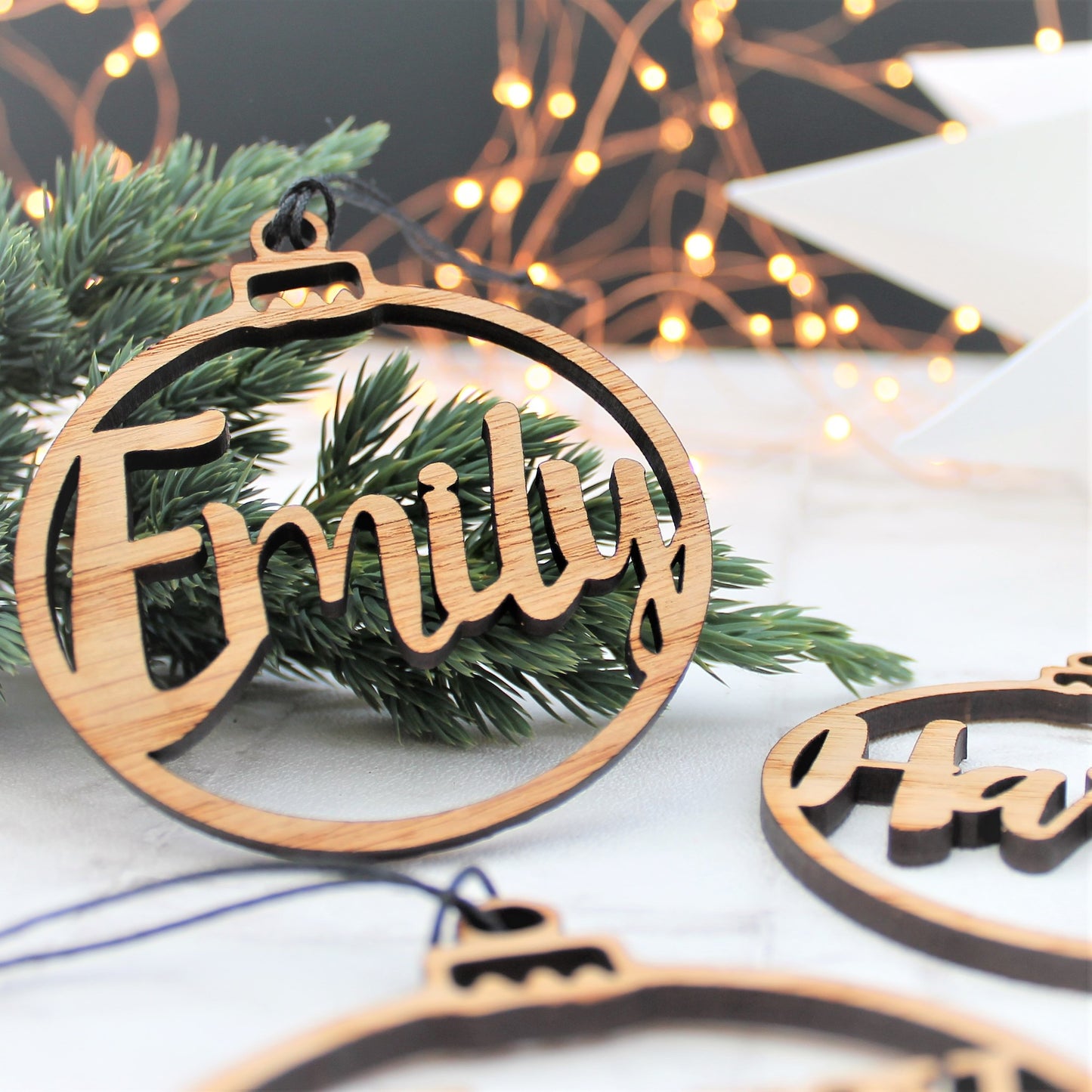 Christmas tree decoration with a custom name made from wood laser cut out 