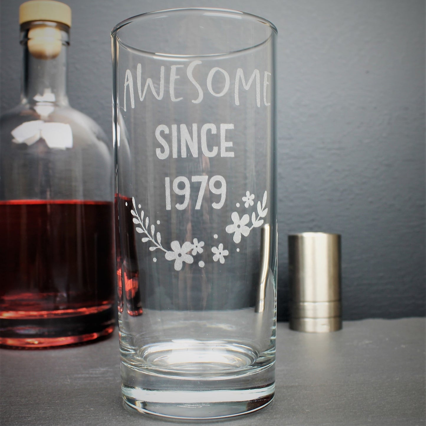 Engraved tall gin glass personalised with birthday year on and flower design
