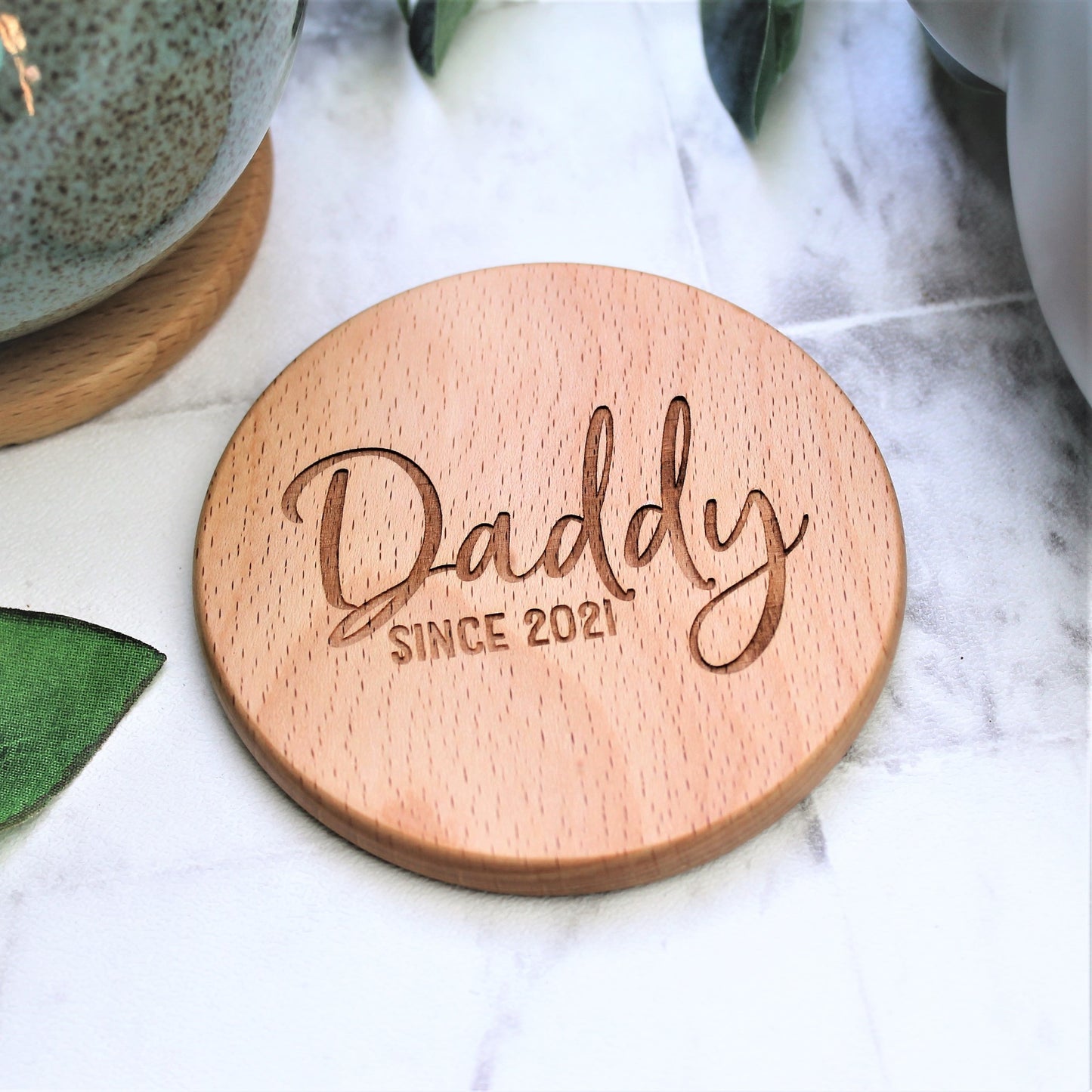 personalised daddy coaster, engraved on a round wooden disk. Perfect for fathers day