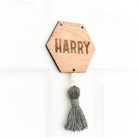 wooden hexagonal door sign for nursery, engarved with name or word of choice with coloured tassel 