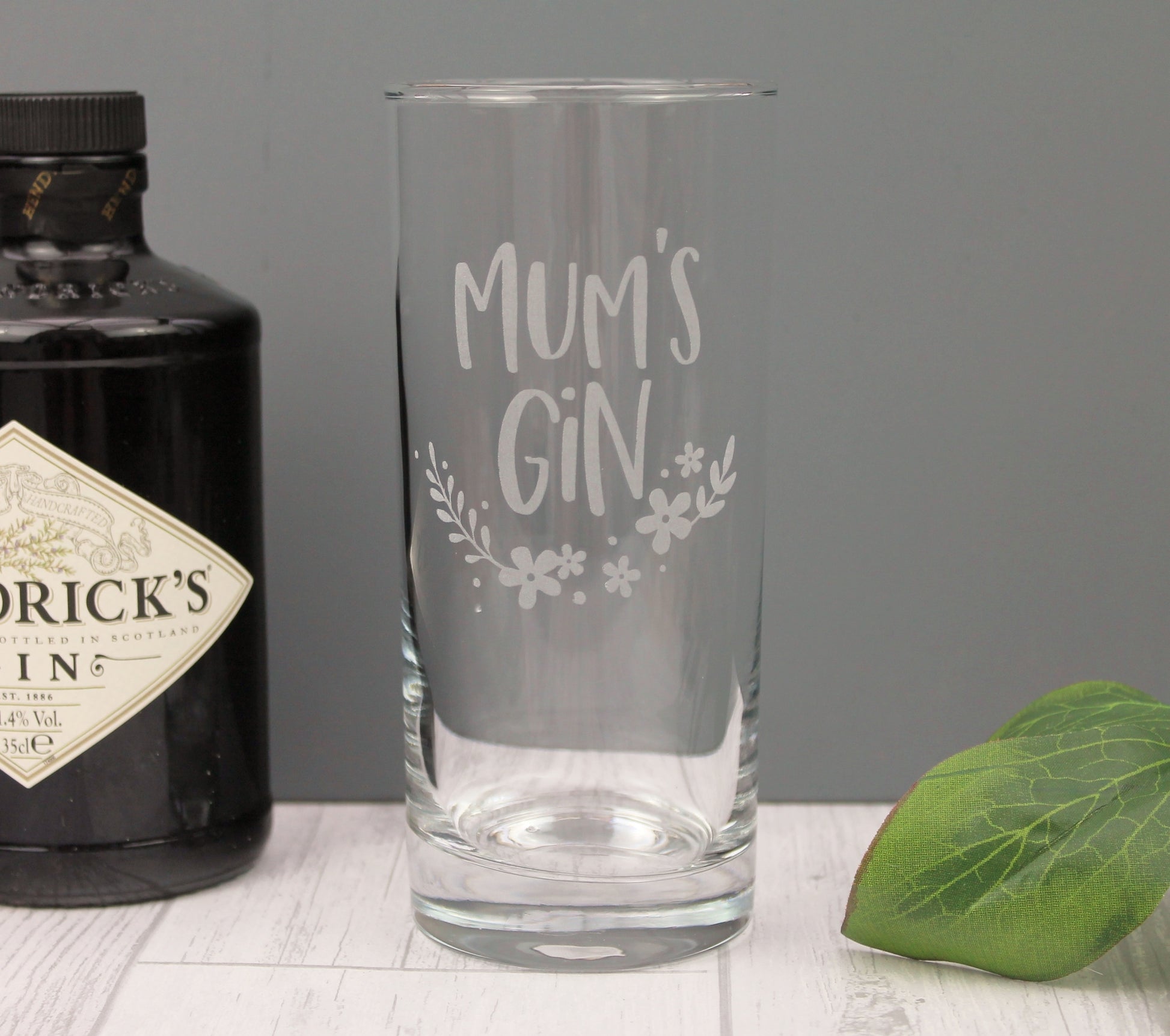 Engraved highball glass with engraved wording mum's gin. With a floral design it would be an ideal mothers day gift 