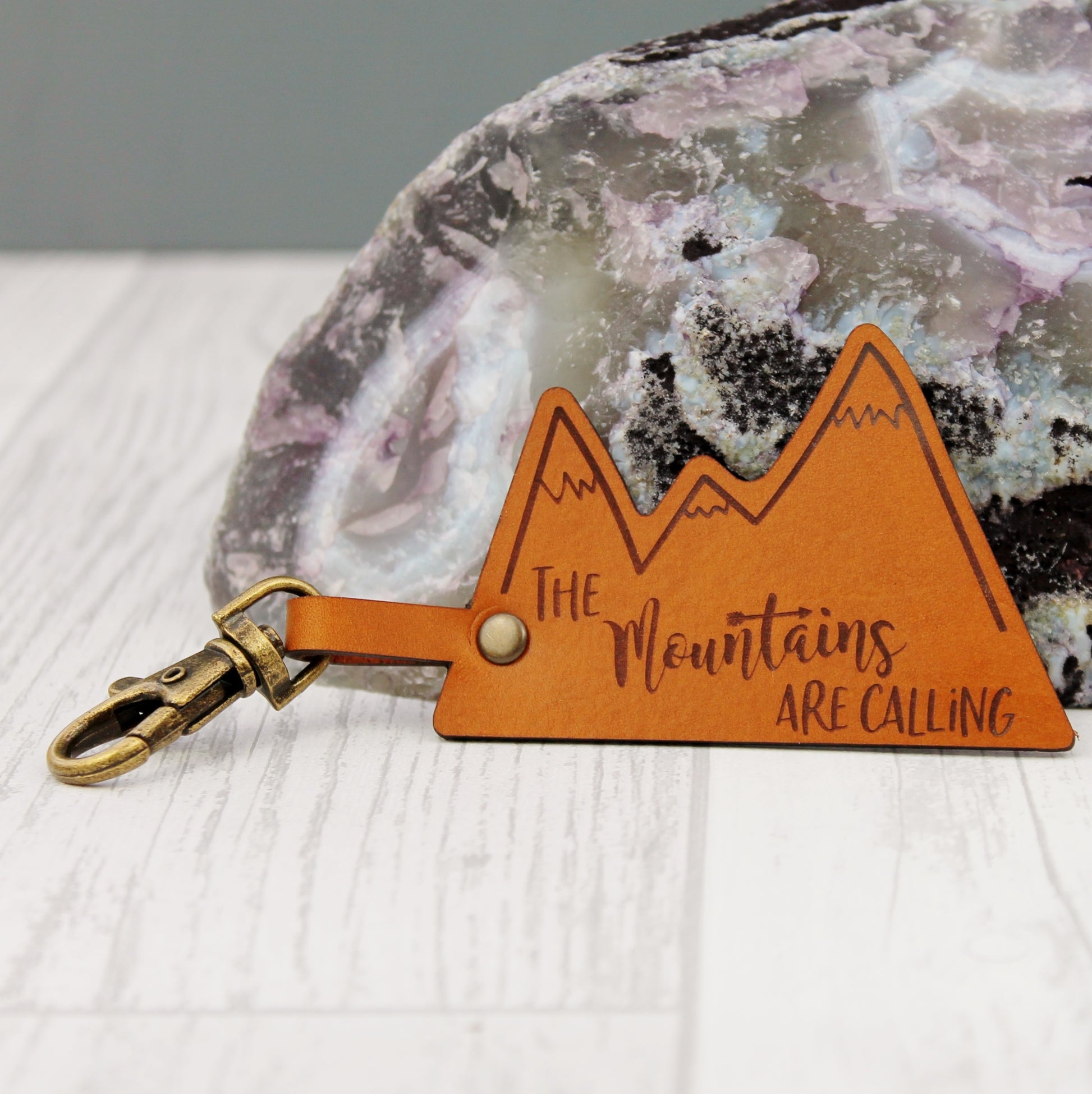 The mountains are calling adventurer gift made from leather and engraved woth design 