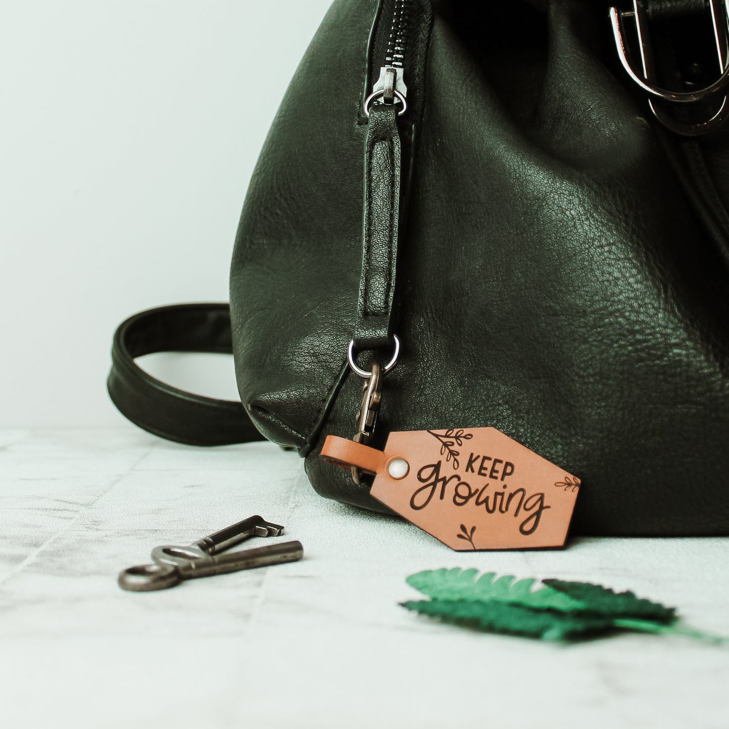 keep growing plant lover bag clasp made from whisky tan coloured leather 
