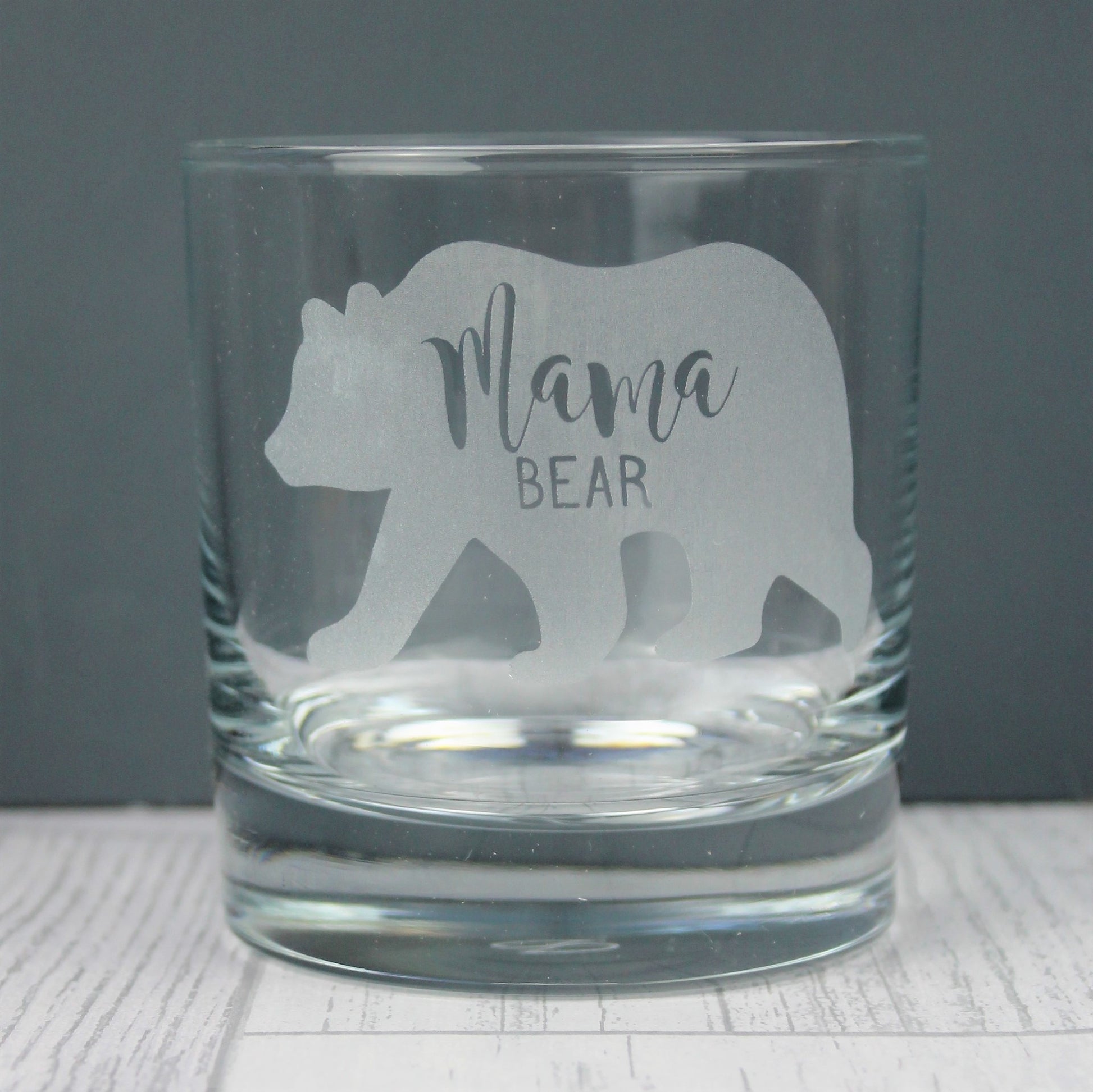 glass tumbler with mama bear design engraved onto it