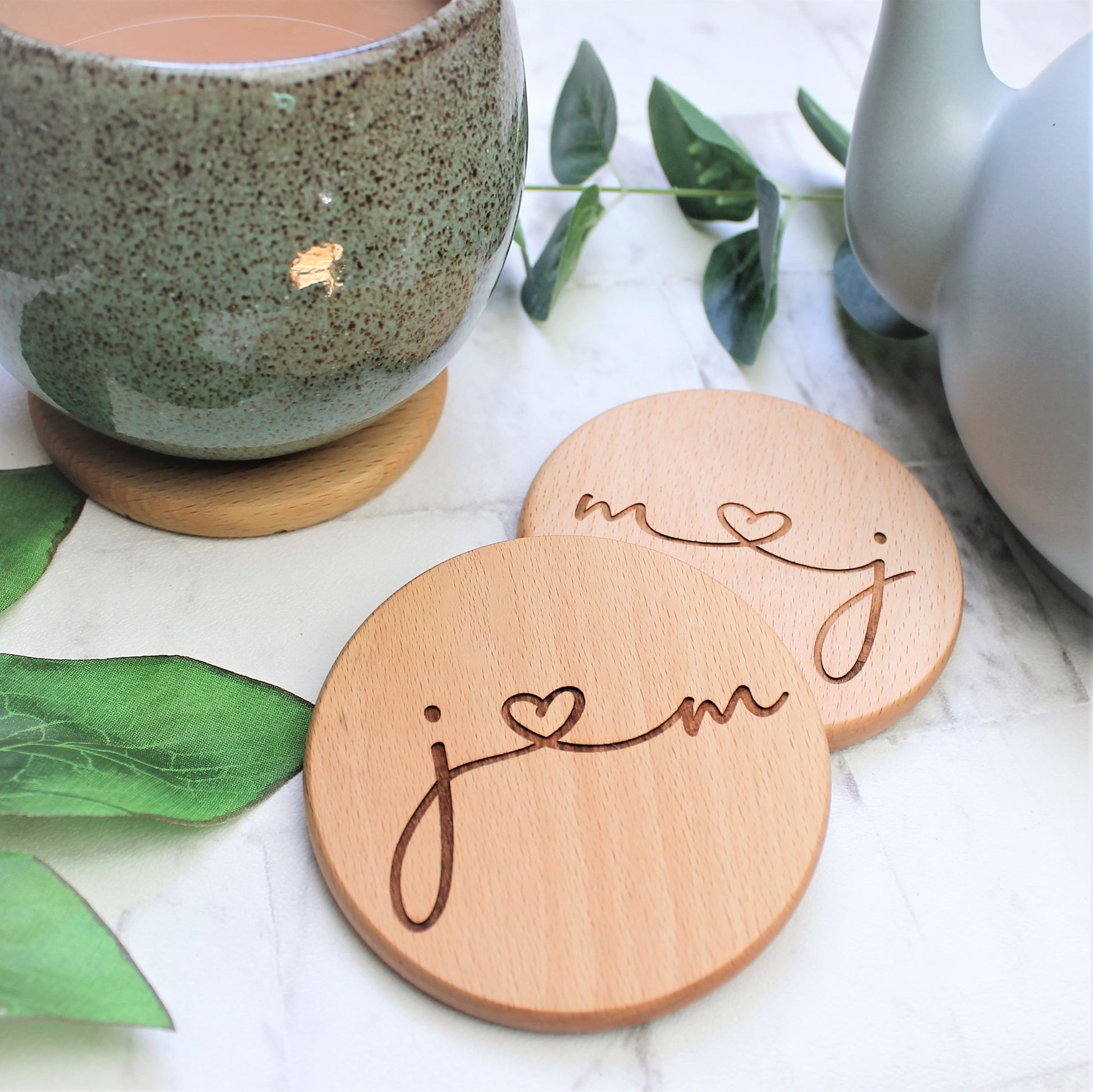wooden coaster engraved with couples initials  