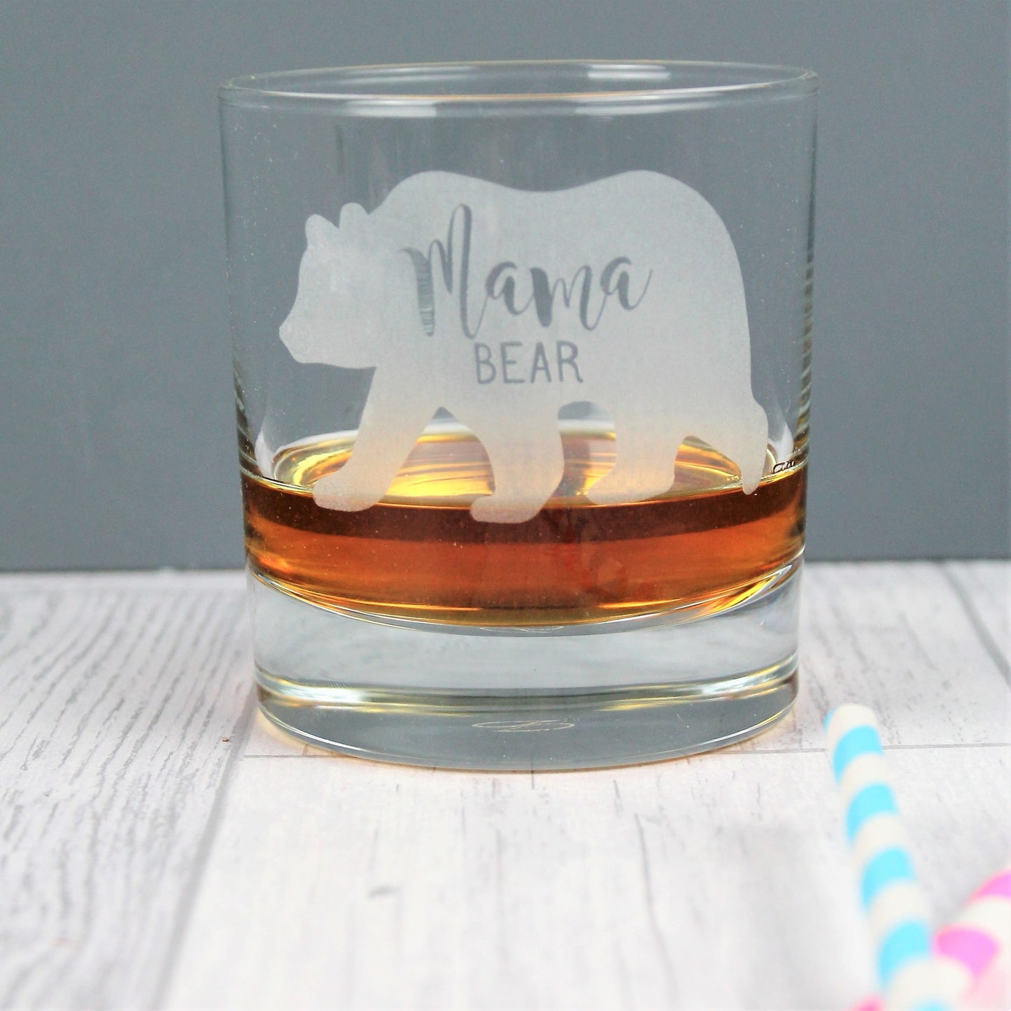 Engraved bear design on whisky tumbler glass with the words mama bear