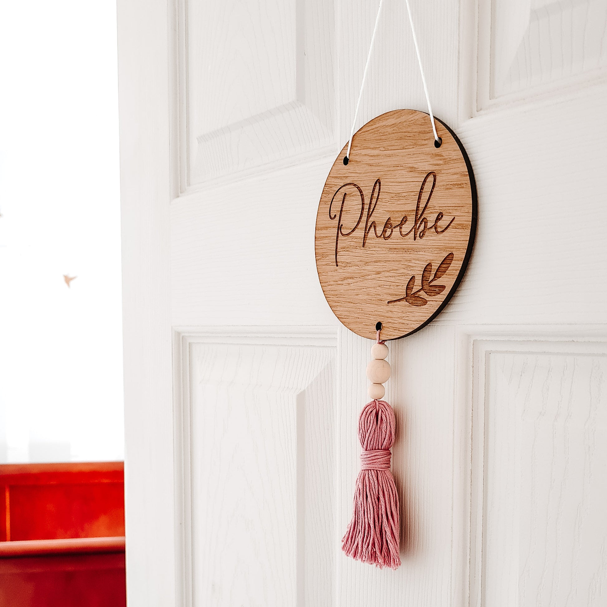 round engraved wooden sign with word or name of your choice and tassel colour