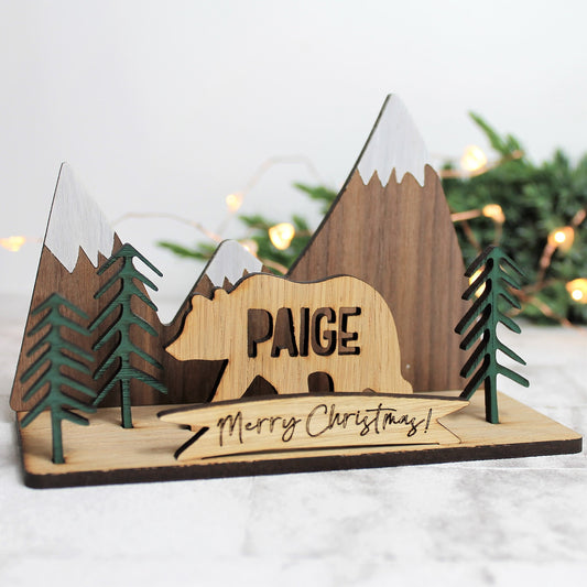Wooden bear with cut out personalised name 3d model with mountain and forest winter scene