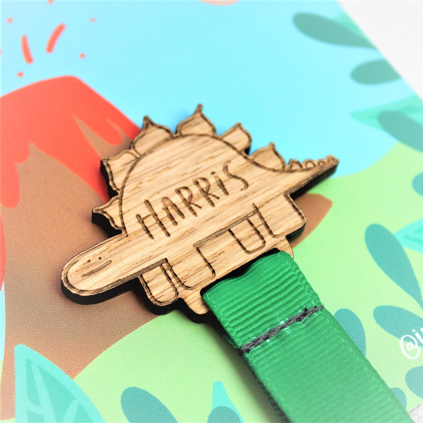 child's personalised bookmark dinosaur design wooden with green ribbon 