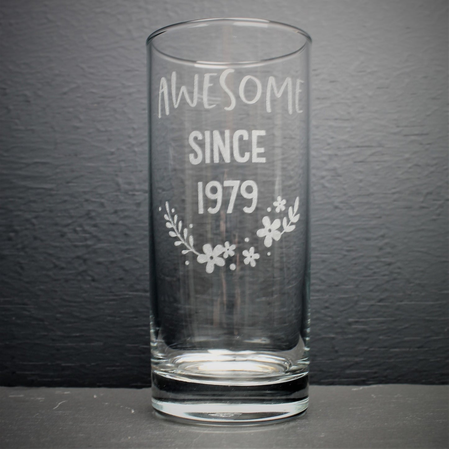 Engraved tall gin glass personalised with birthday year on and flower design