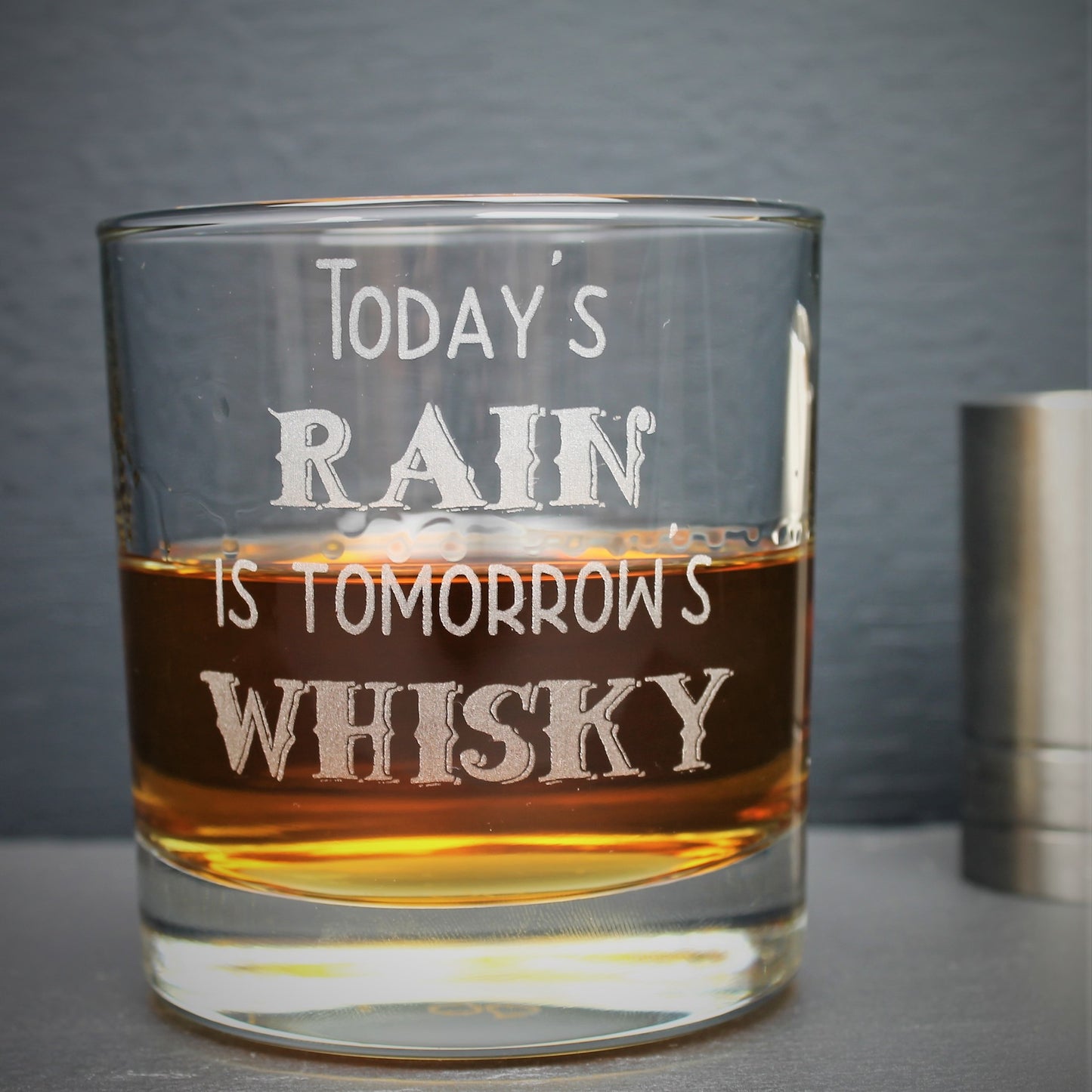 Engraved whisky glass etched with the Scottish quote, todays rain is tomorrows whisky