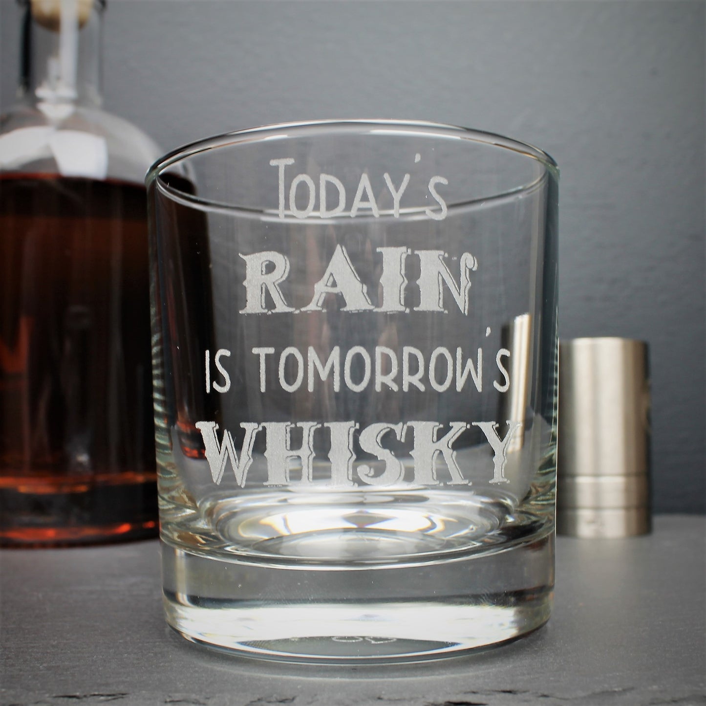 Engraved whisky glass etched with the Scottish quote, todays rain is tomorrows whisky
