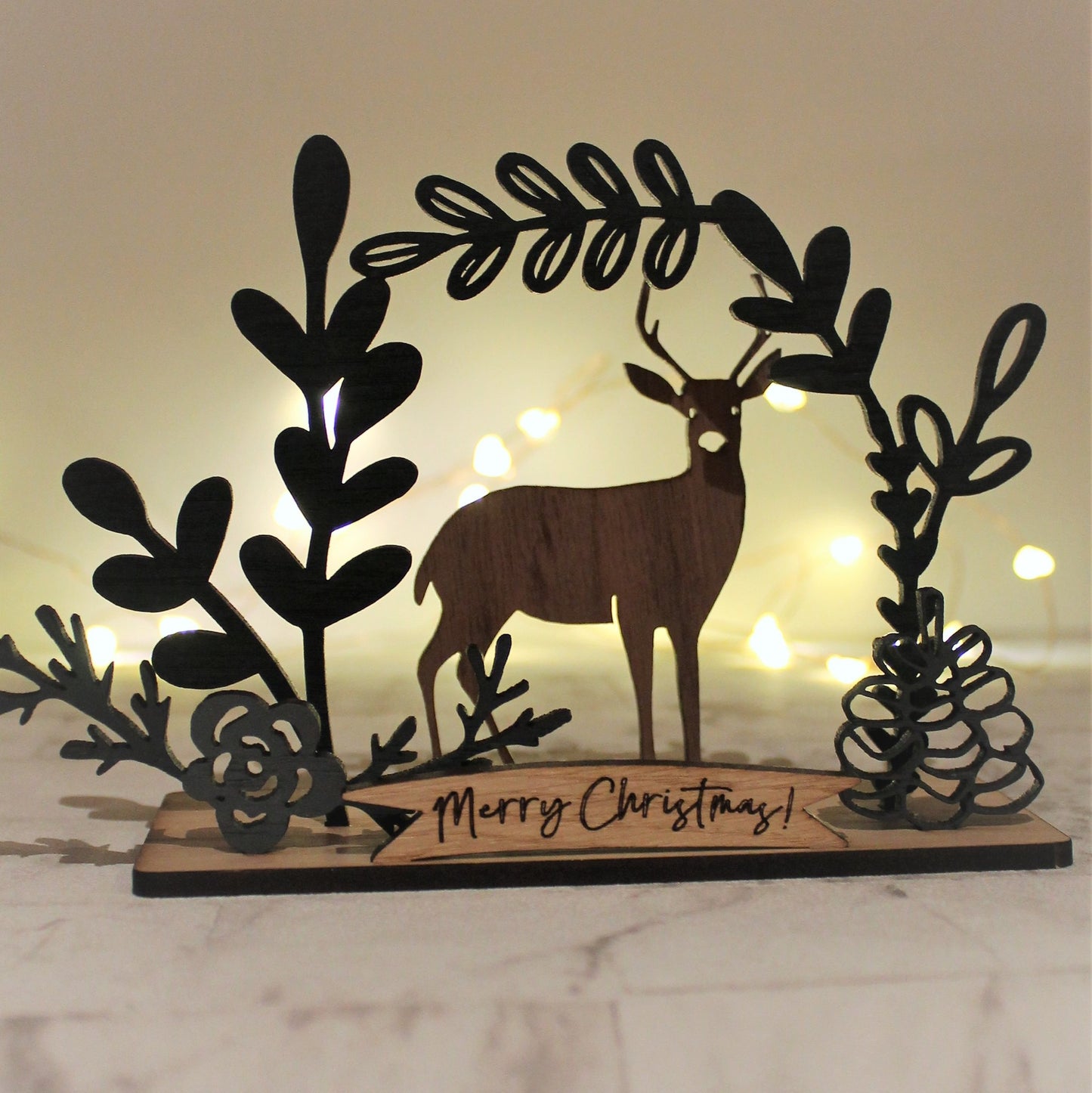 Silhouette of deer in wood, backlit wooden ornament