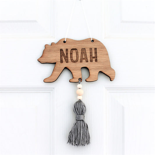 wooden engraved bear with personalised name and coloured tassel 