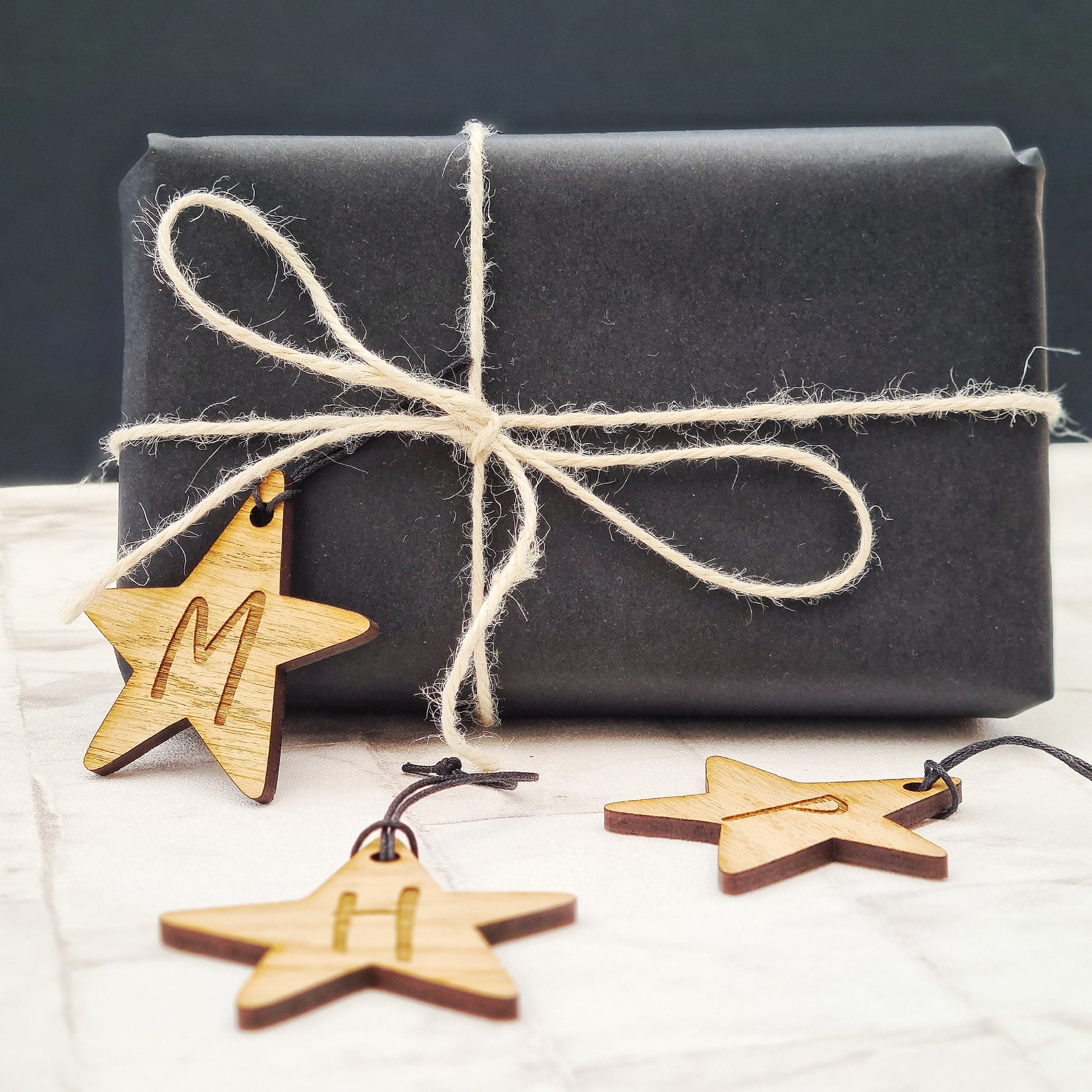 wooden gift tag personalised with initials of your choice shaped like a star